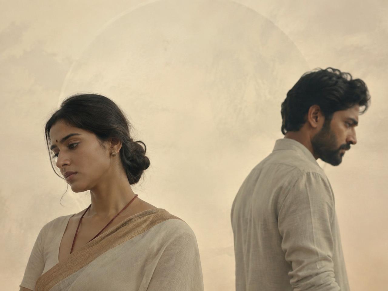 Indian couple standing apart during an emotional separation